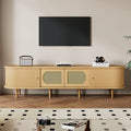 Meuble TV ovale 180x40x40 cm couleur bois clair avec design en rotin, deux portes de placard, deux portes coulissantes, meuble télé bas de salon en MDF, adapté aux téléviseurs jusqu'à 75 pouces