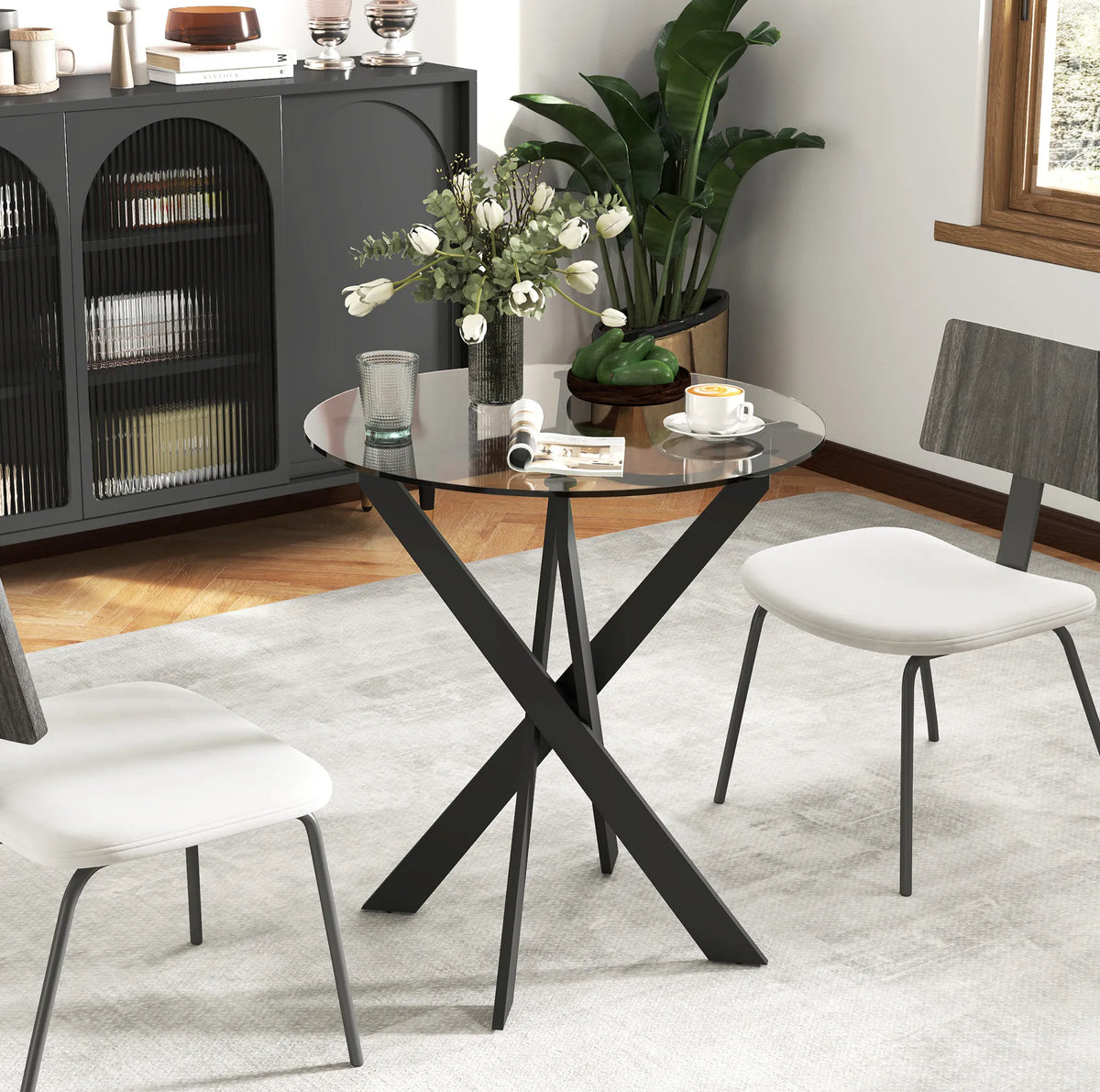 Table à manger ronde pour 4 personnes avec plateau en verre trempé de 8 mm et pieds en acier noir (Ø 70 x 75 cm)
